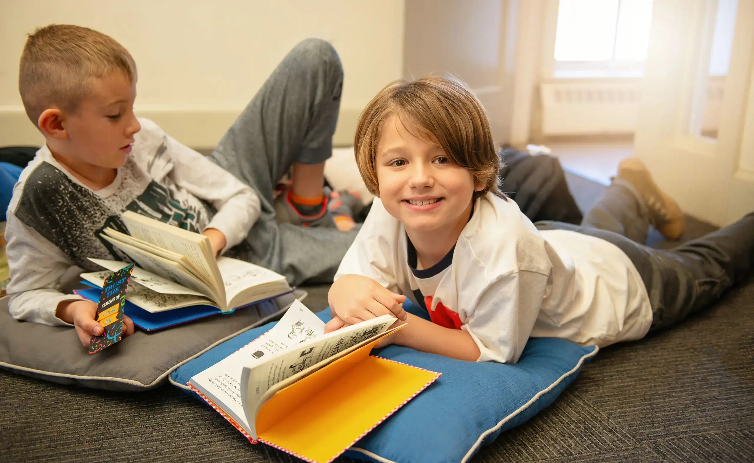 Student looking up from reading a book