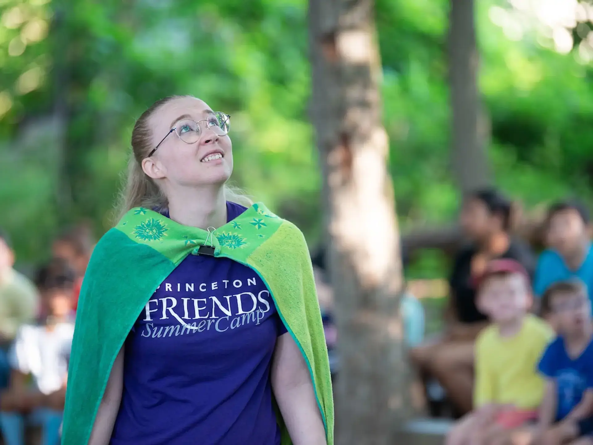 Student wearing flag looking yp