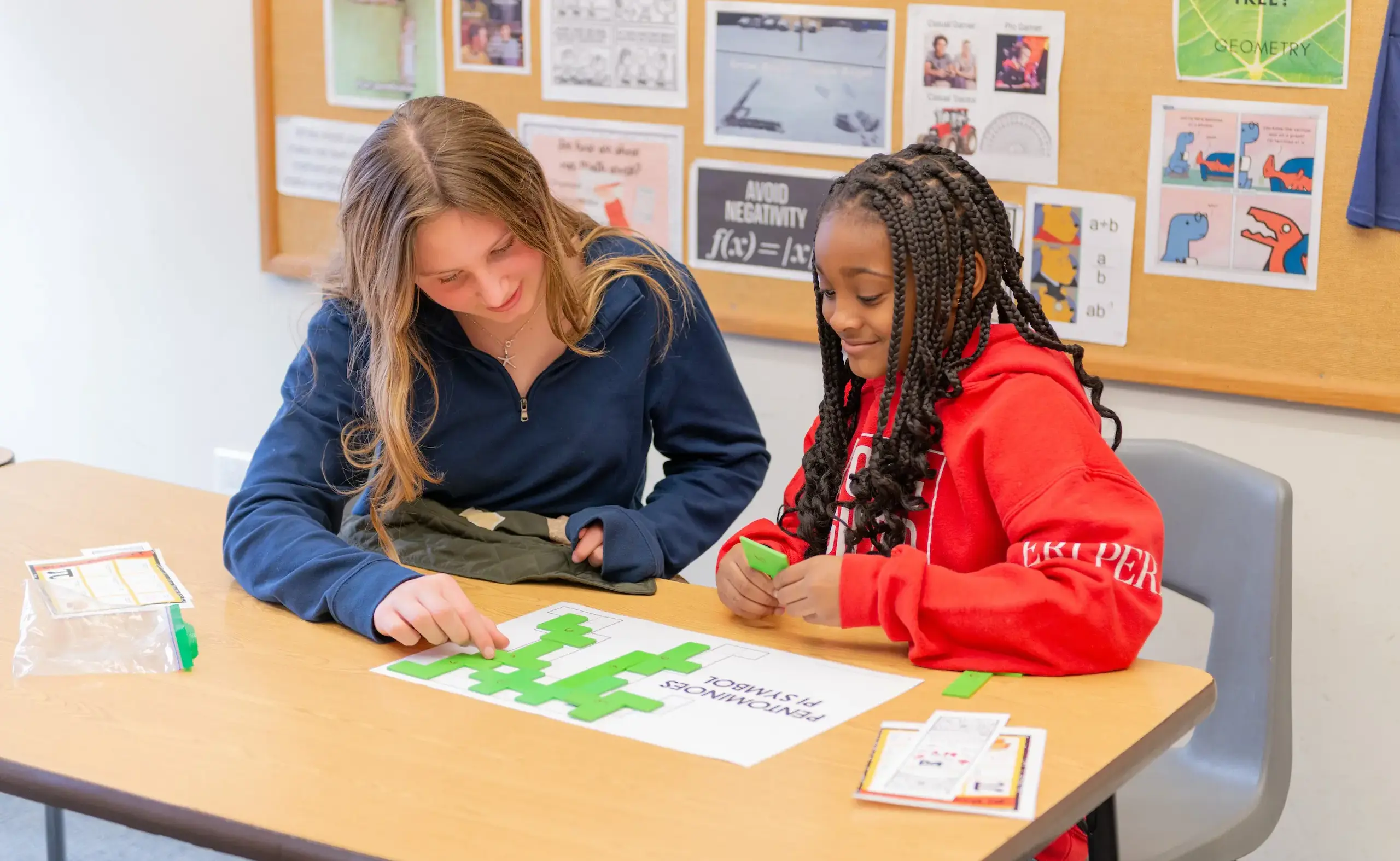 Two students working at desk