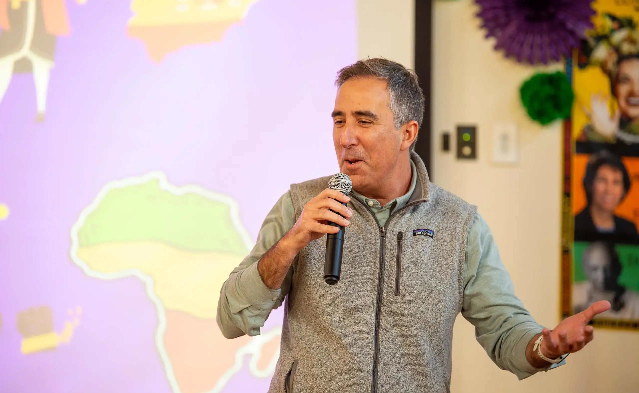 Headmaster speaking into a microphone