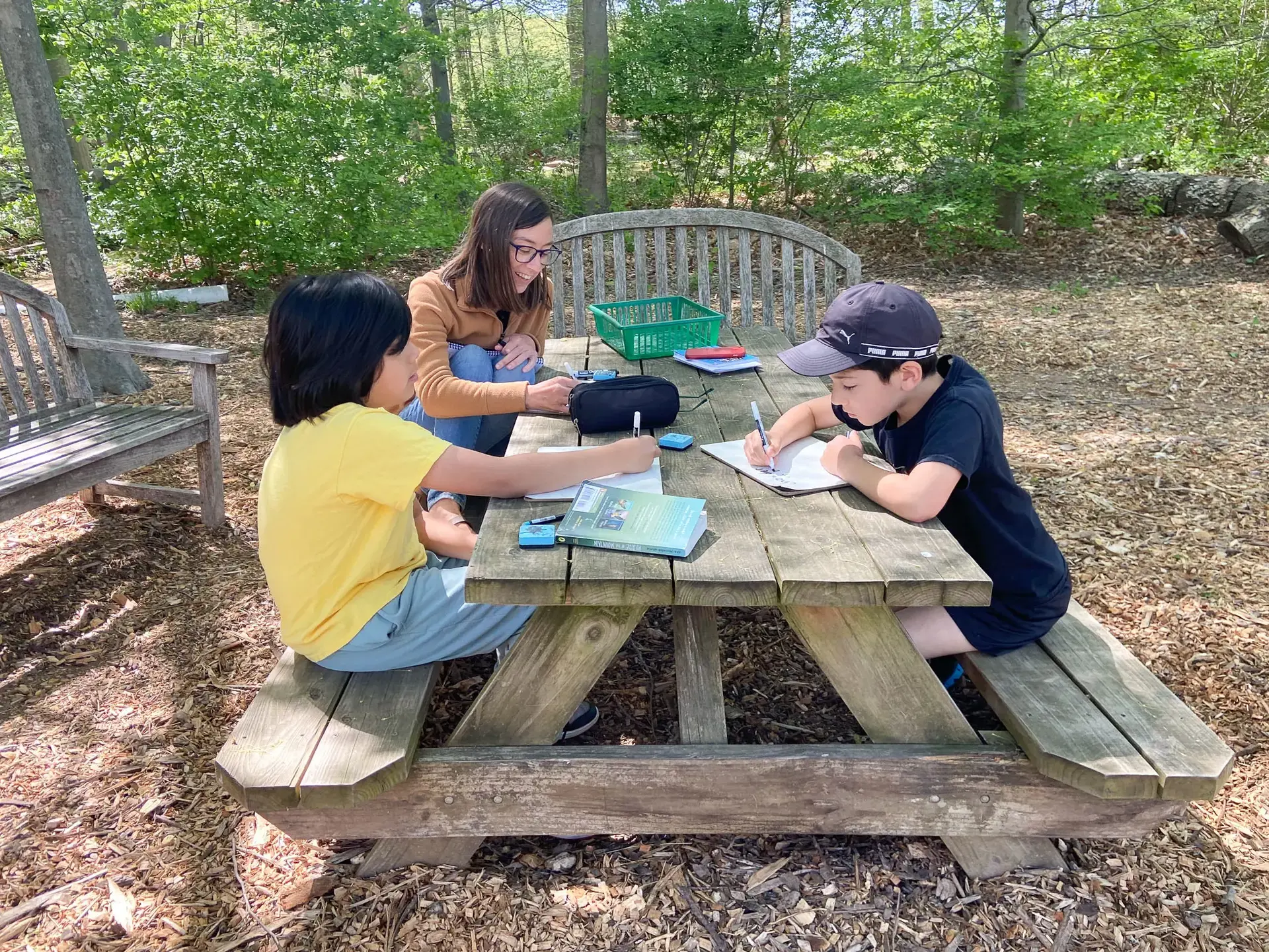 Students working at a picnic table