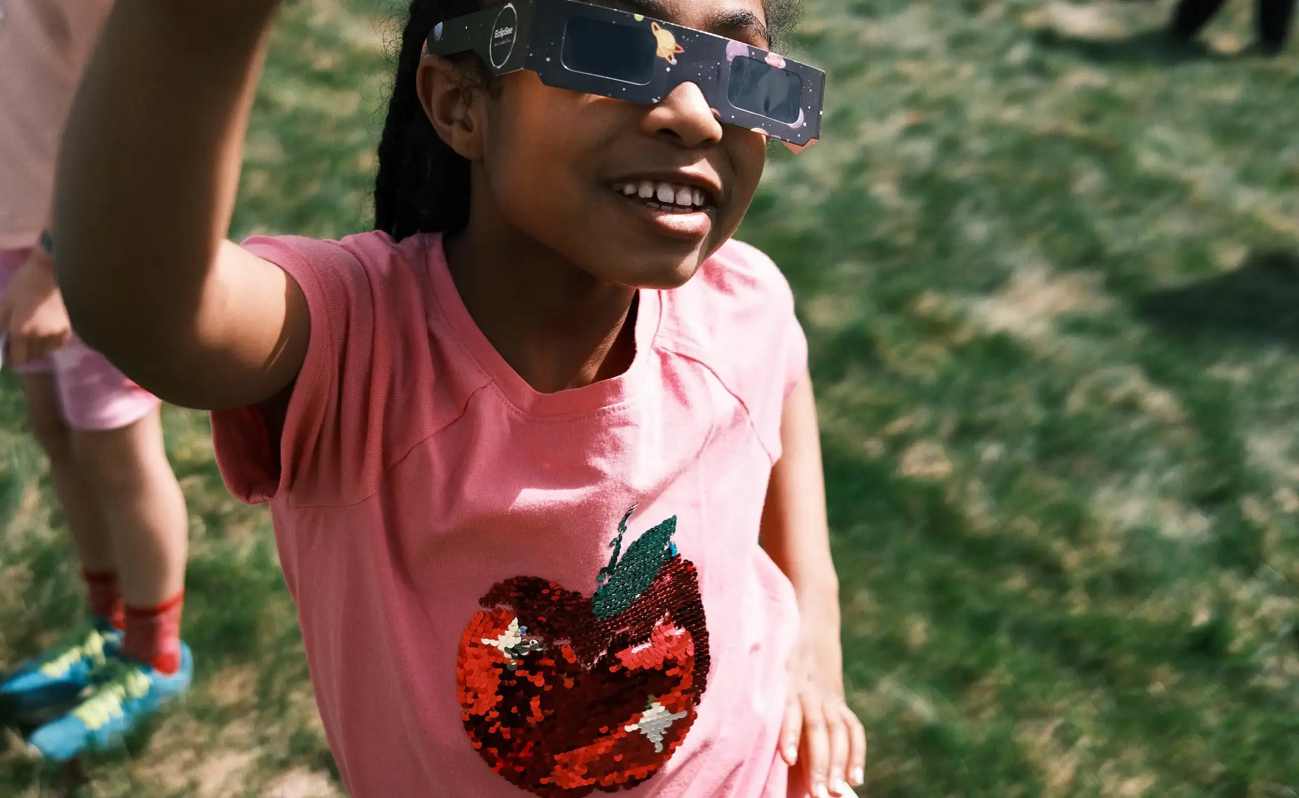 Student looking up at eclipse