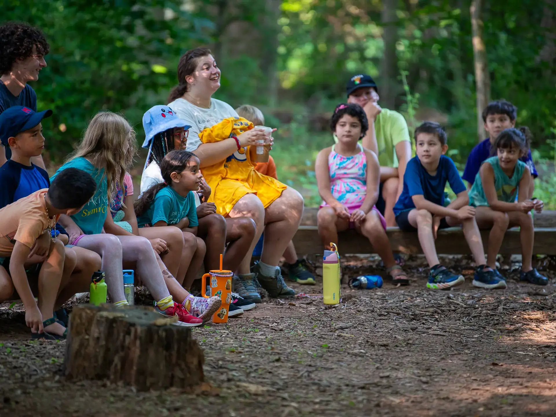 Students sitting around campfire
