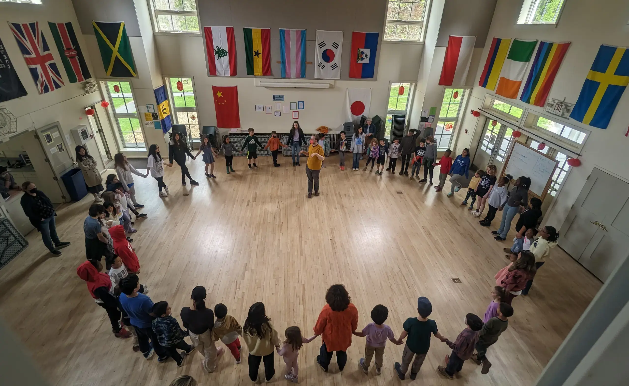 Students holding hands in circle