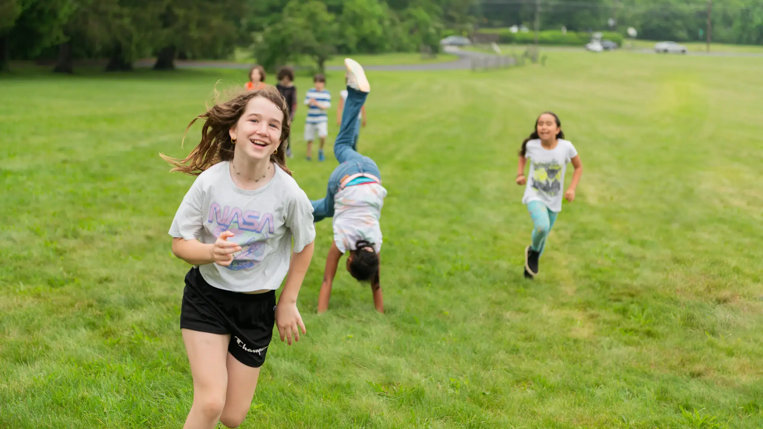 Students running through field