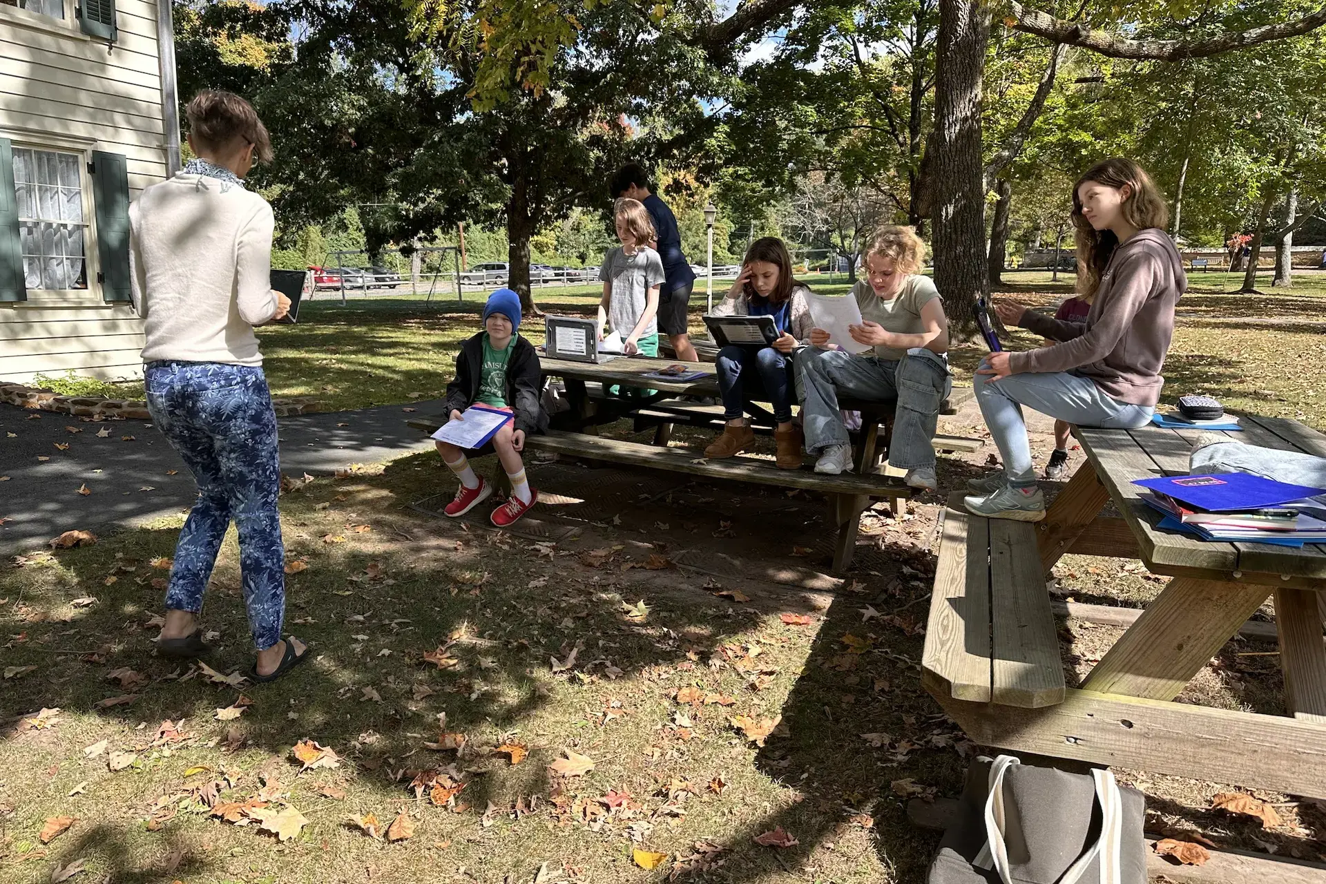 Students sitting on picnic tables